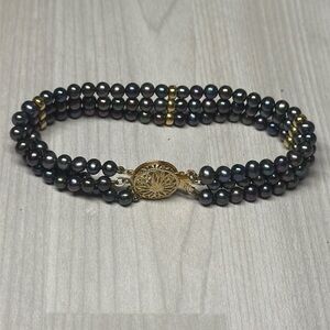 14k Yellow Gold Elegant Black Natural Multi-Strand Pearl Bracelet.